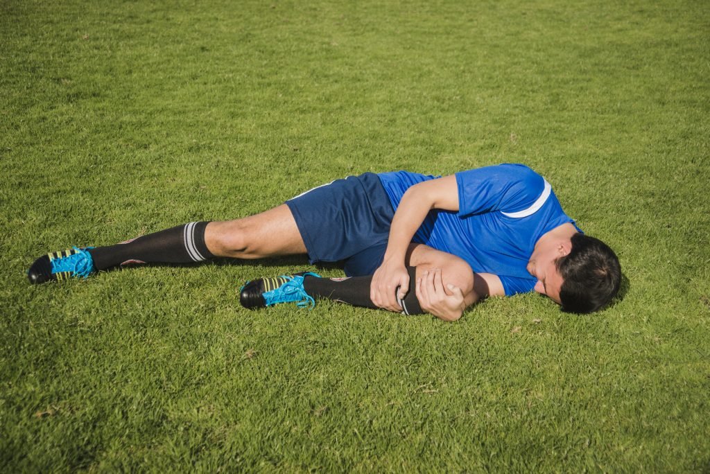 Injured footballer on floor